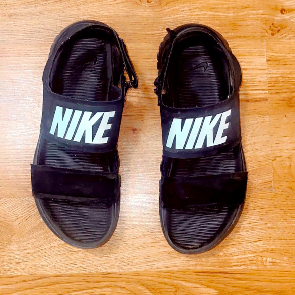 Nike rubber slides/ sandals with Velcro strap. Black with white logo. Size 8!